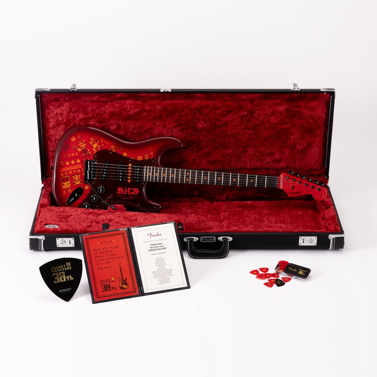 Stratocaster vermelha de Pokémon na maleta com certificado e palhetas comemorativas